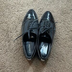Black Calvin Klein pointed toe loafers
